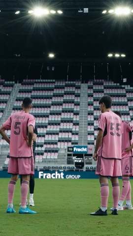 Three Inter Miami CF player standing on the pitch.