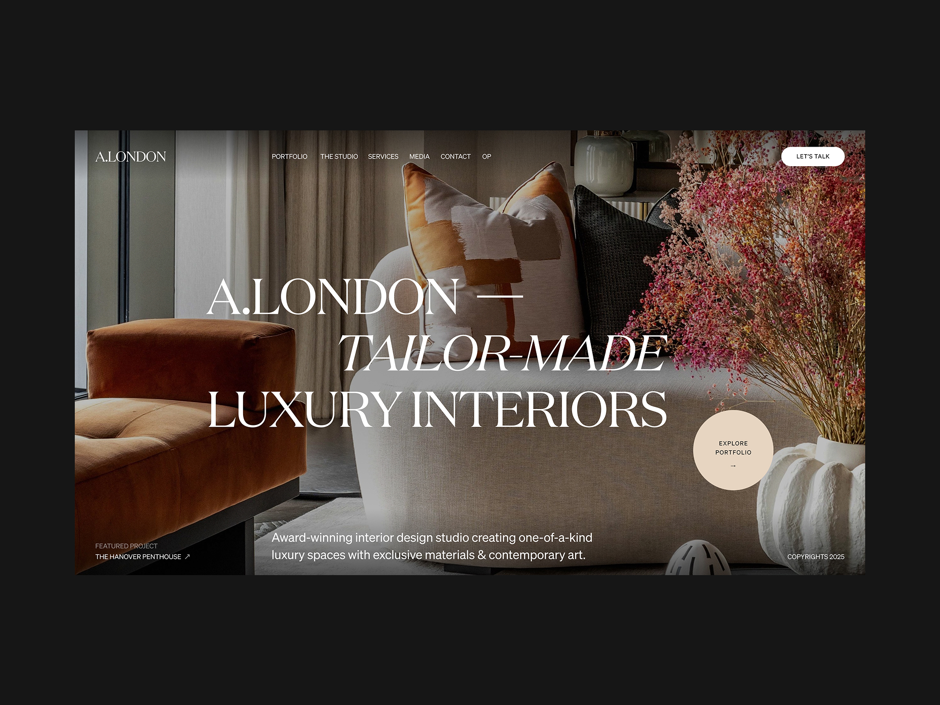 Homepage of A.LONDON, a luxury interior design studio, featuring a stylish living room with a modern armchair, designer pillows, and decorative floral arrangement.