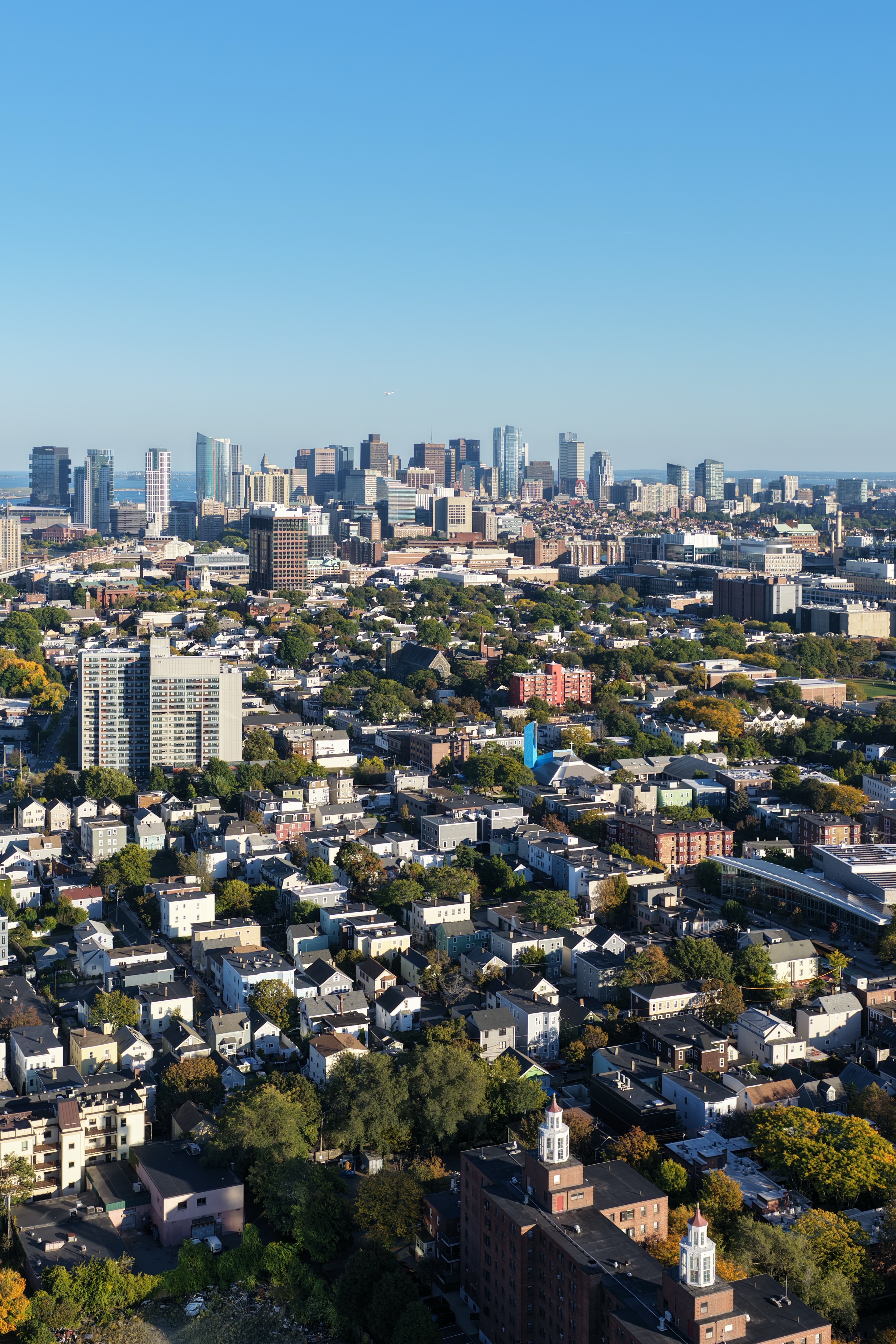 Vertical drone image of the Boston skyline during the day