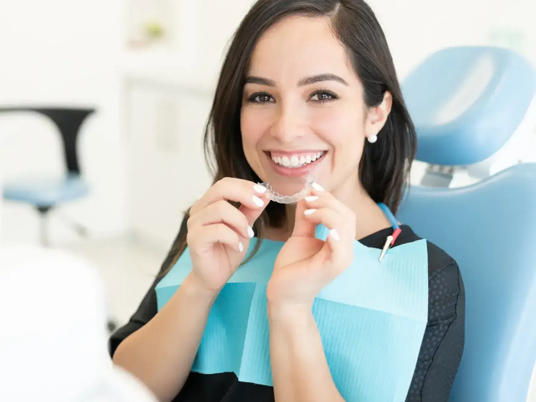 Woman smiling with aligners
