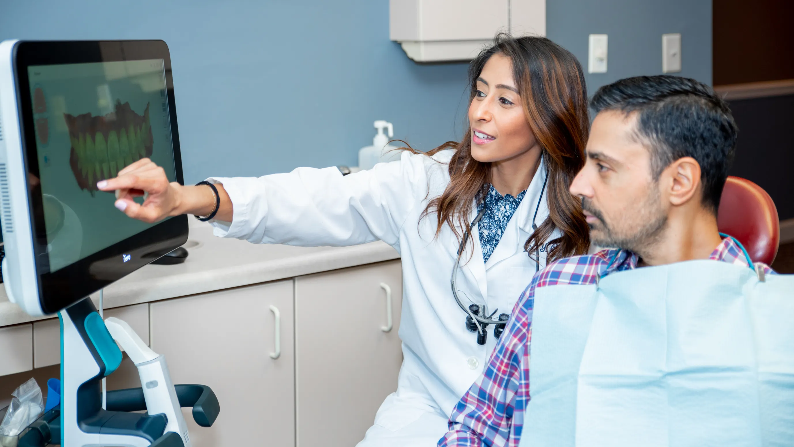 Dr. Cara showing patient a scan