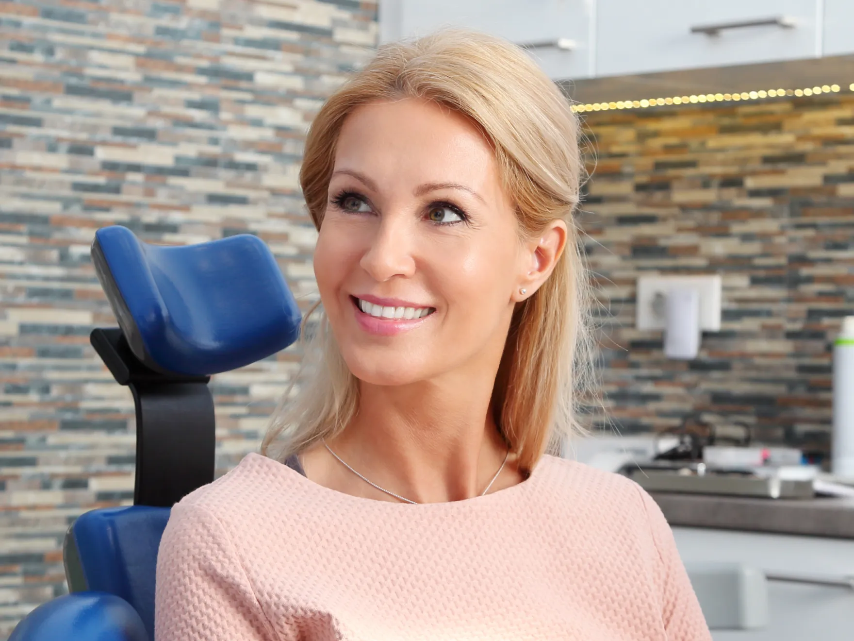 Patient smiling in chair