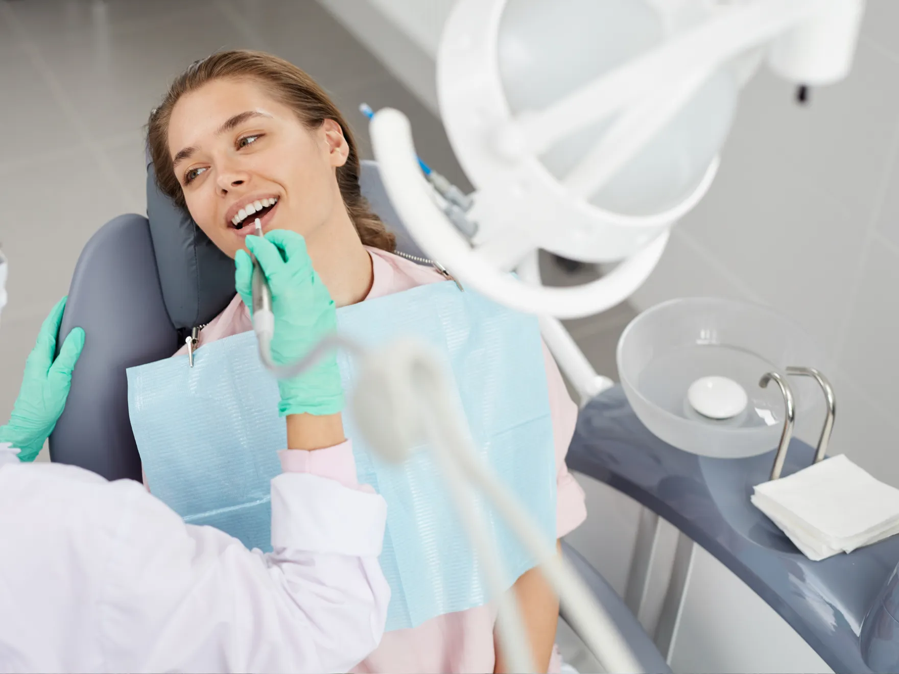 Patient in dental chair getting checked out