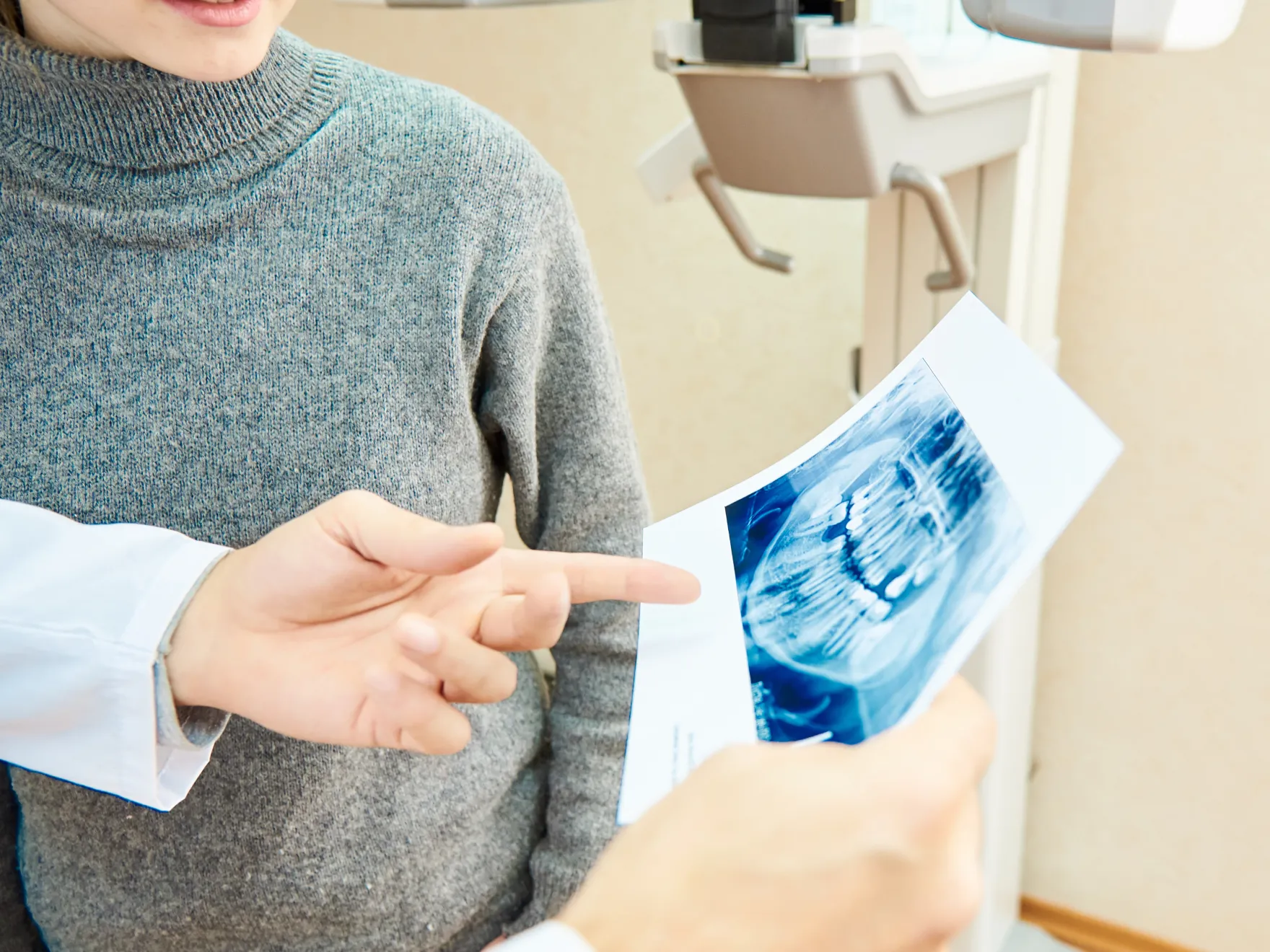 Doctor showing dental x-rays to patient 