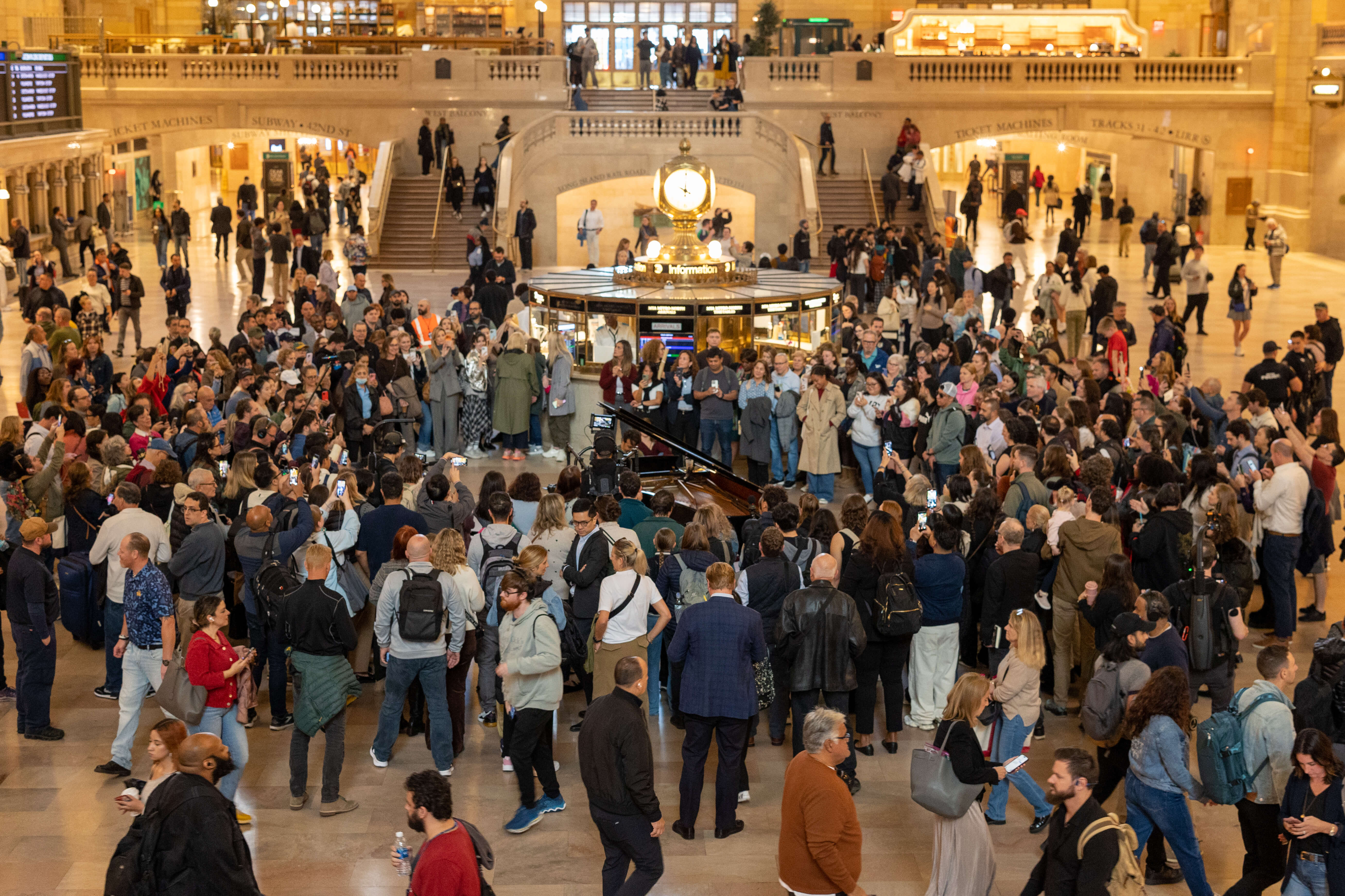 People walking around Grand Central's Main Concourse during Dear New York an art installation.