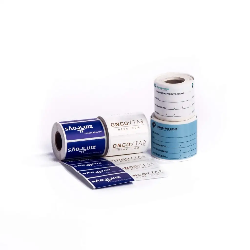 Four rolls of medical labels, including blue São Luiz and white OncoStar labels, and two rolls of Oswaldo Cruz product and date labels.