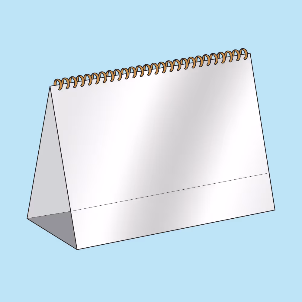 Blank white desk calendar with a triangular base and gold spiral binding on a light blue background.