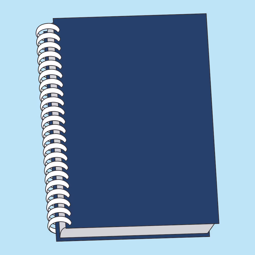 Closed dark blue spiral-bound notebook on a light blue background.