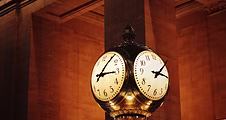 Vintage clock representing hours of service regulations for commercial truck drivers.