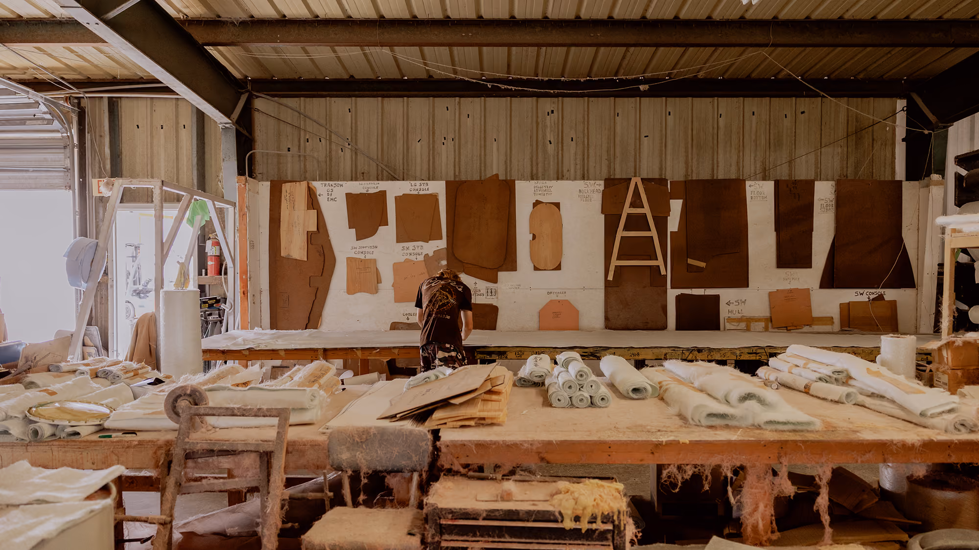 skiff builder looking through samples