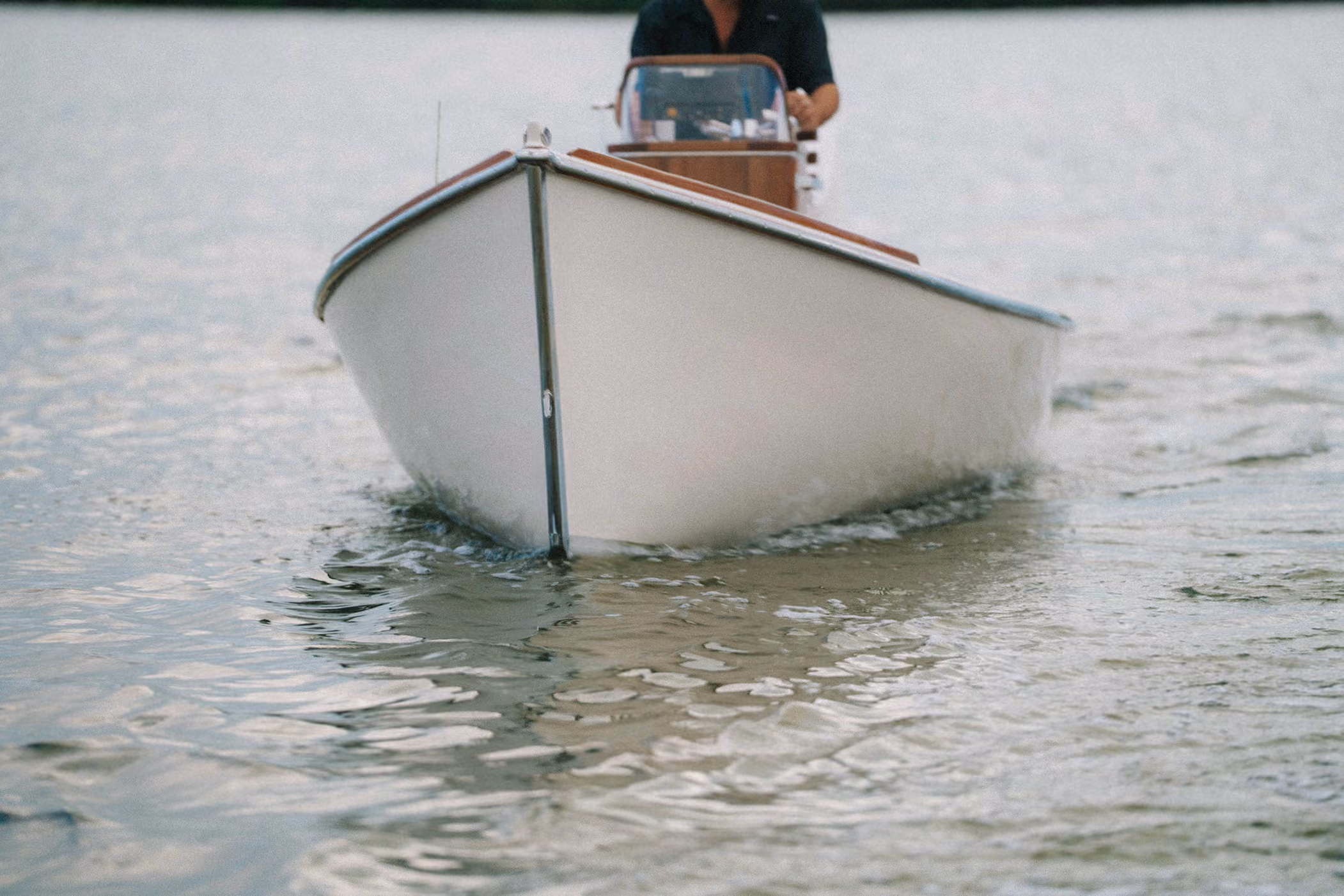 classic runabout boat on the water