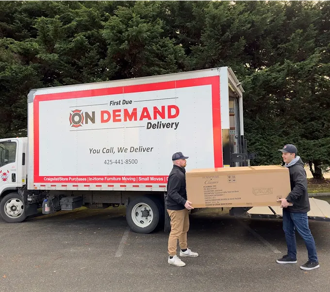 first due movers vehicle and team carrying packages