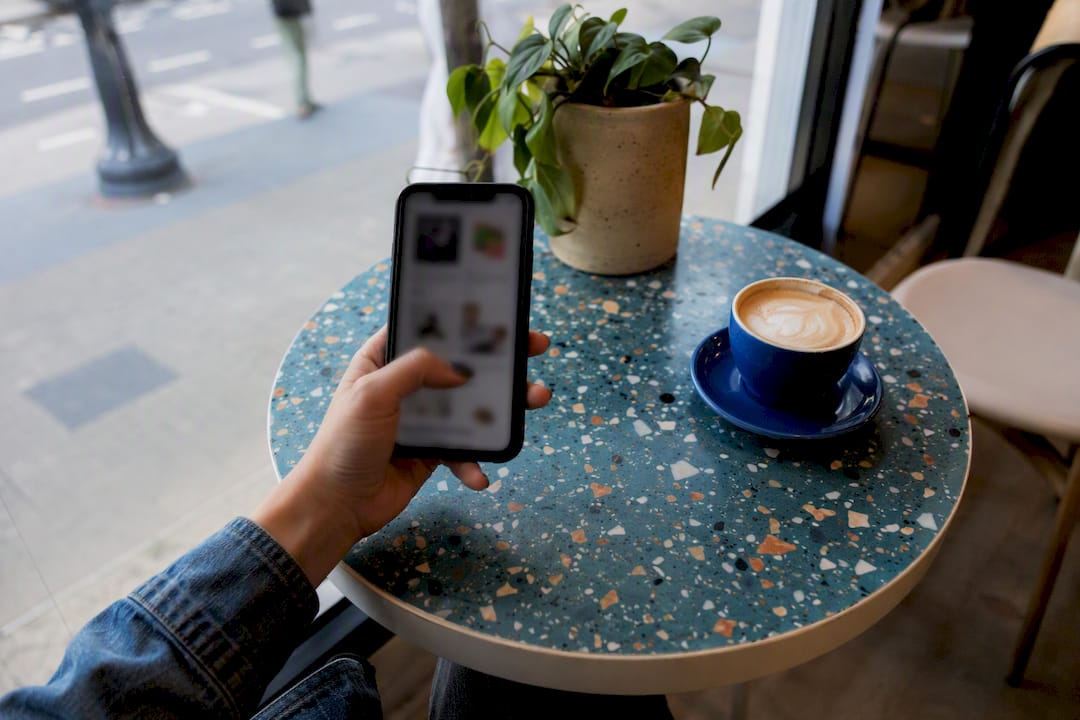 Hand holding phone showing product page scroll flow