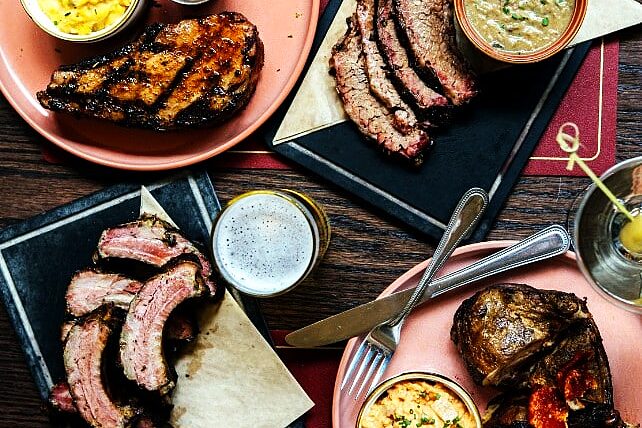 Pan-seared New York strip steak on a white plate from Chef Tim Love's TODAY Show appearance