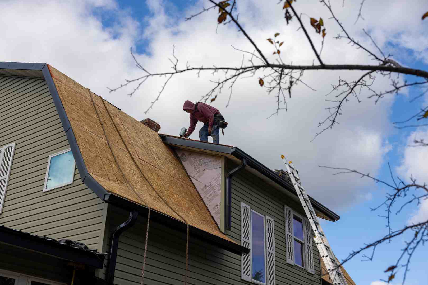 professional roofing crew at work on a Northwoods home - Land O’ Lakes roofing company