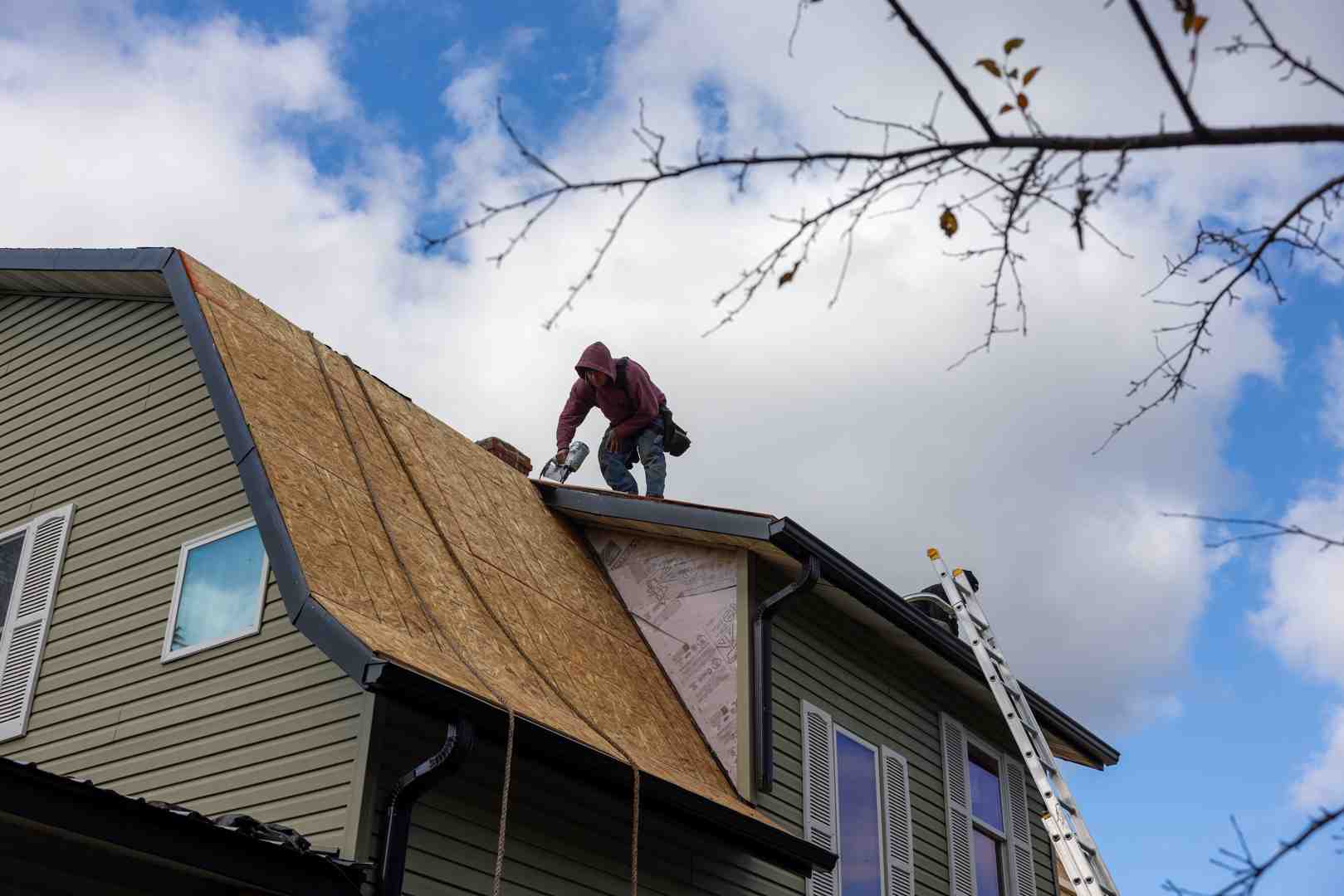 Professional roofing crew installing GAF architectural shingles on a residential home - Roofing General And Cost Questions Professional roofing crew installing GAF architectural shingles on a residential home - Roofing General And Cost Questions