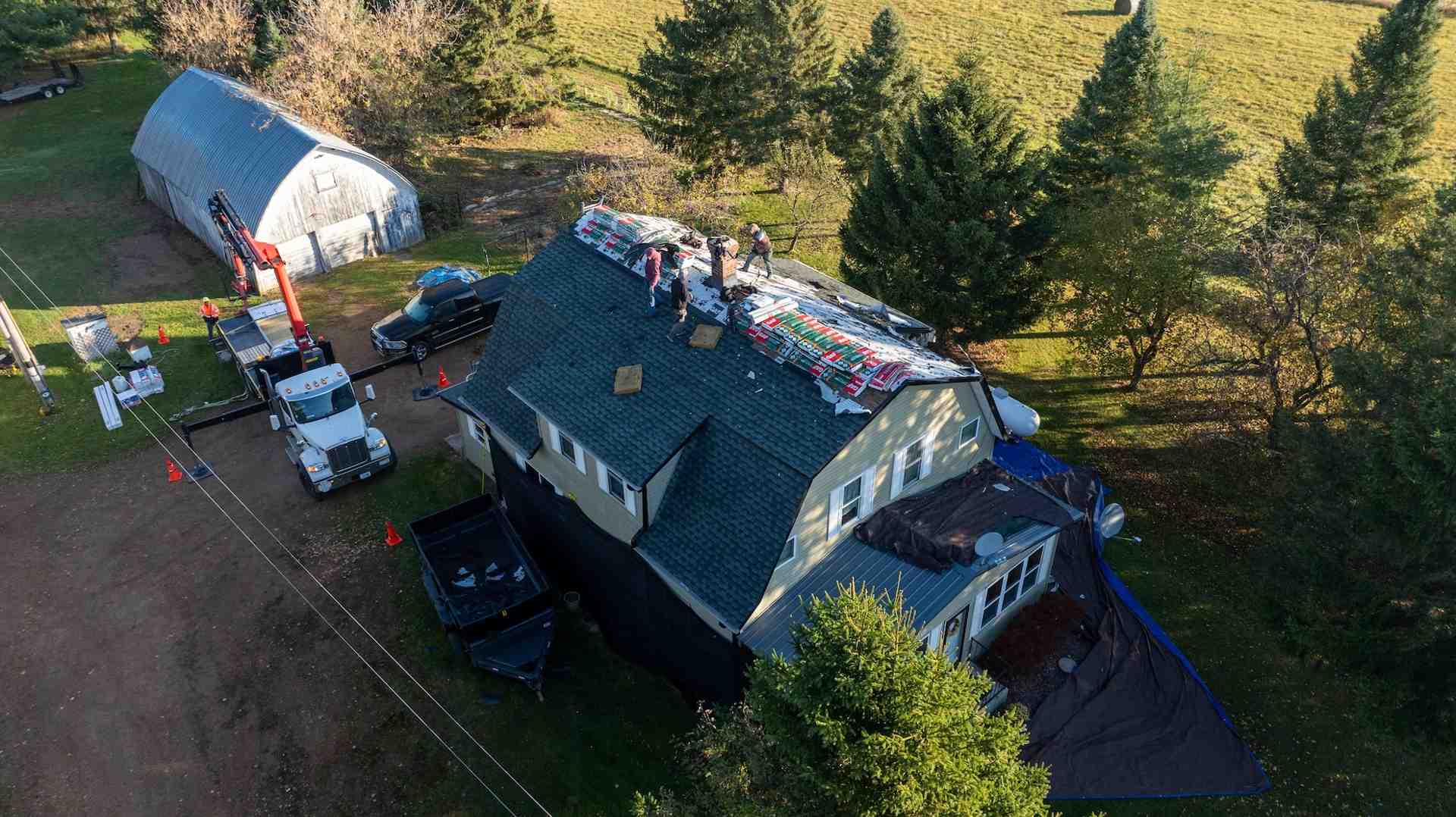 professional roofing crew at a local Eagle River job site - roofing company eagle river wi
