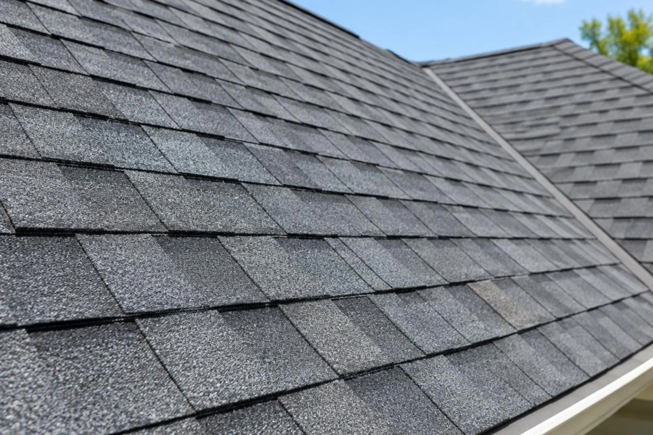 Close-up of durable architectural shingles showing clean lines and proper alignment Close-up of durable architectural shingles showing clean lines and proper alignment