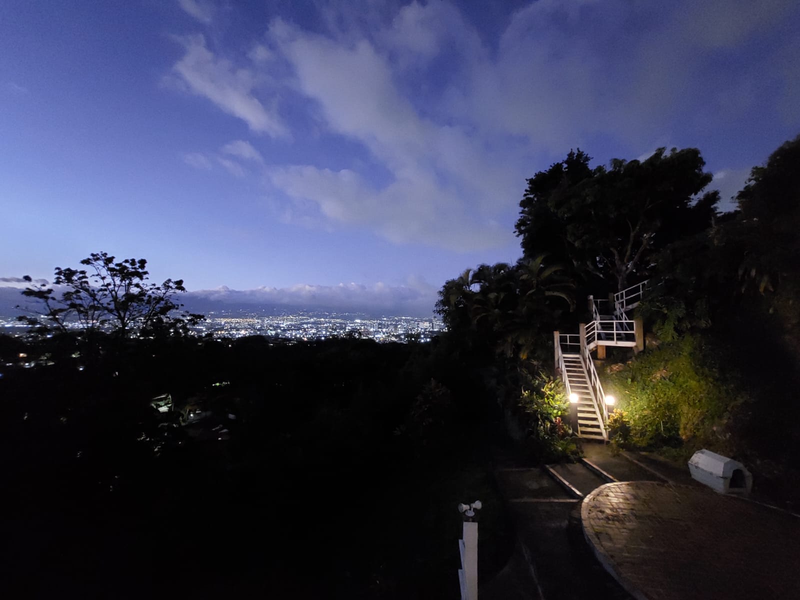 From the Master Bedroom balcony, admire the illuminated terrace and cascading hillside steps framed by panoramic views of San Jose’s glowing skyline.