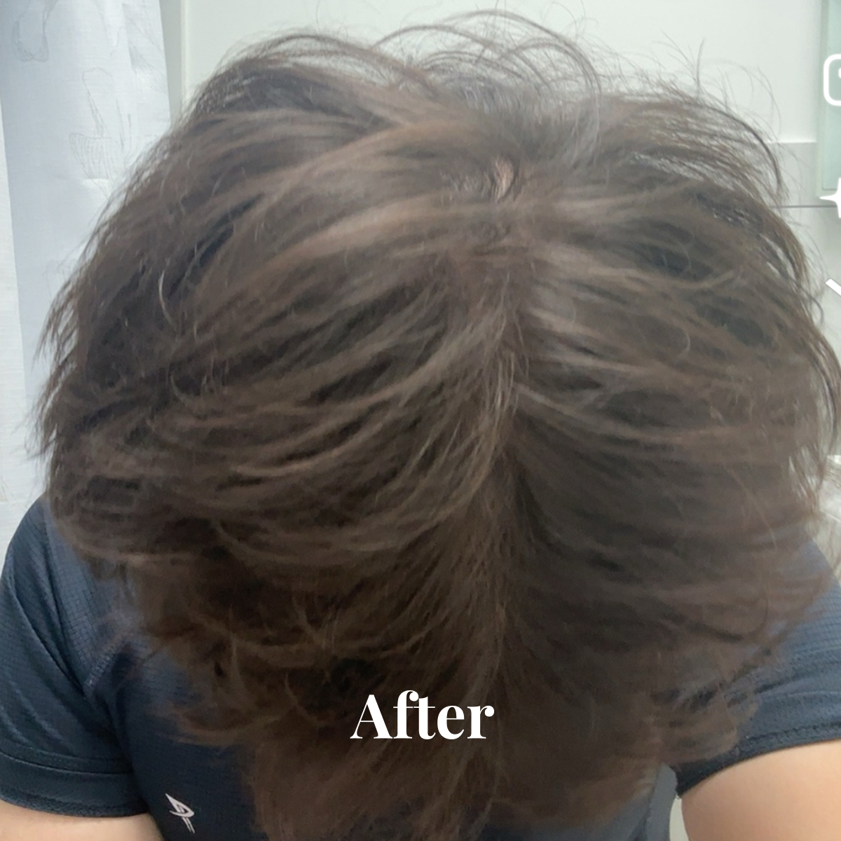 Top view of a person's thick, styled brown hair with the word 'After' overlaid.