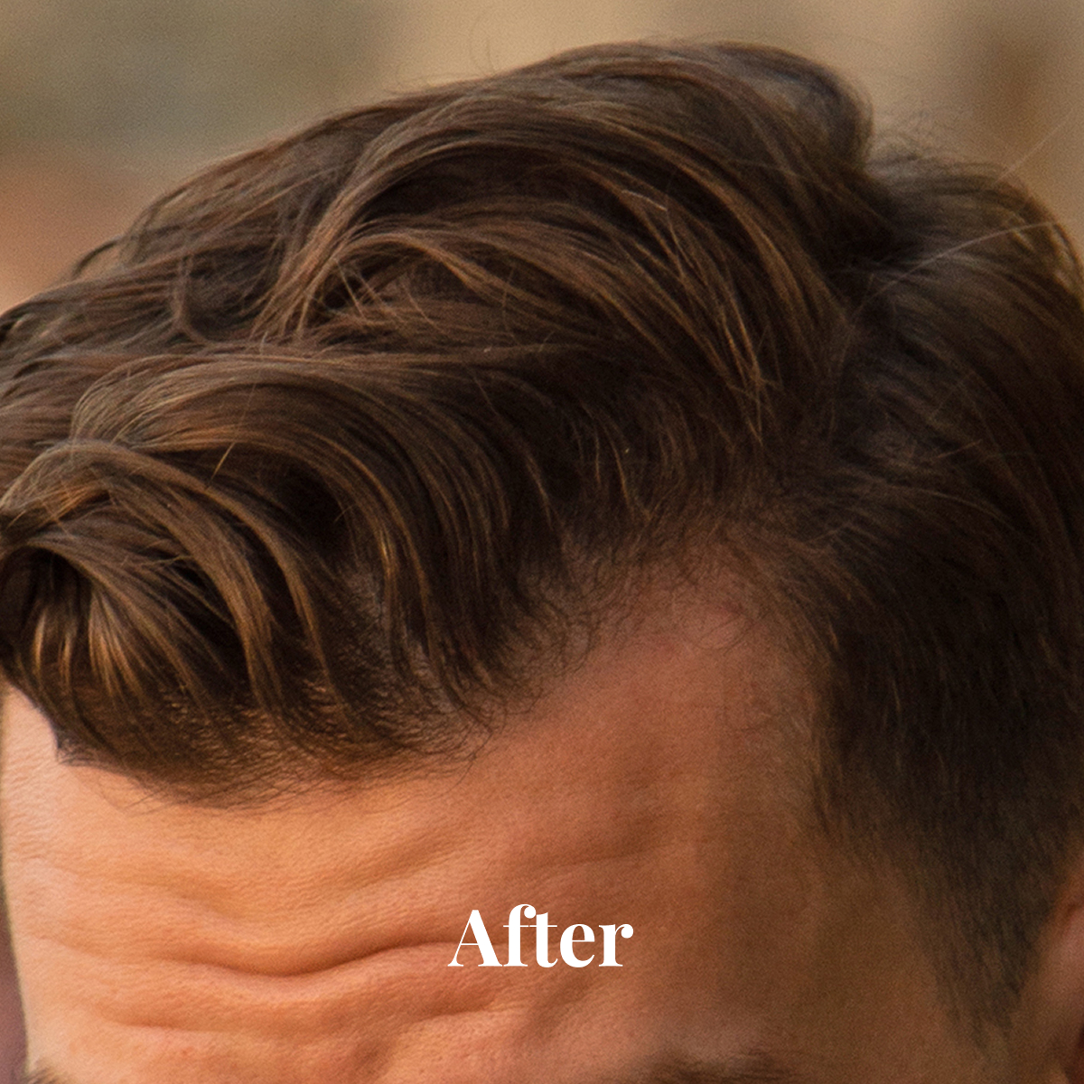 Close-up of a man's styled brown hair with texture and volume.