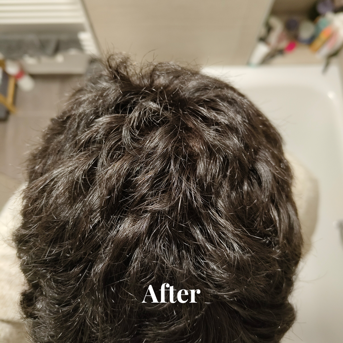 Top view of thick, dark curly hair with the word 'After' overlaid.