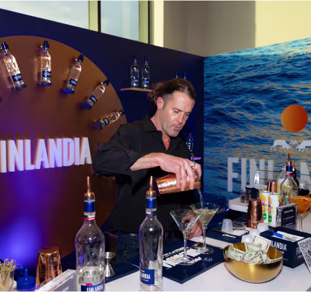 Staff member pouring drinks at WSWA event