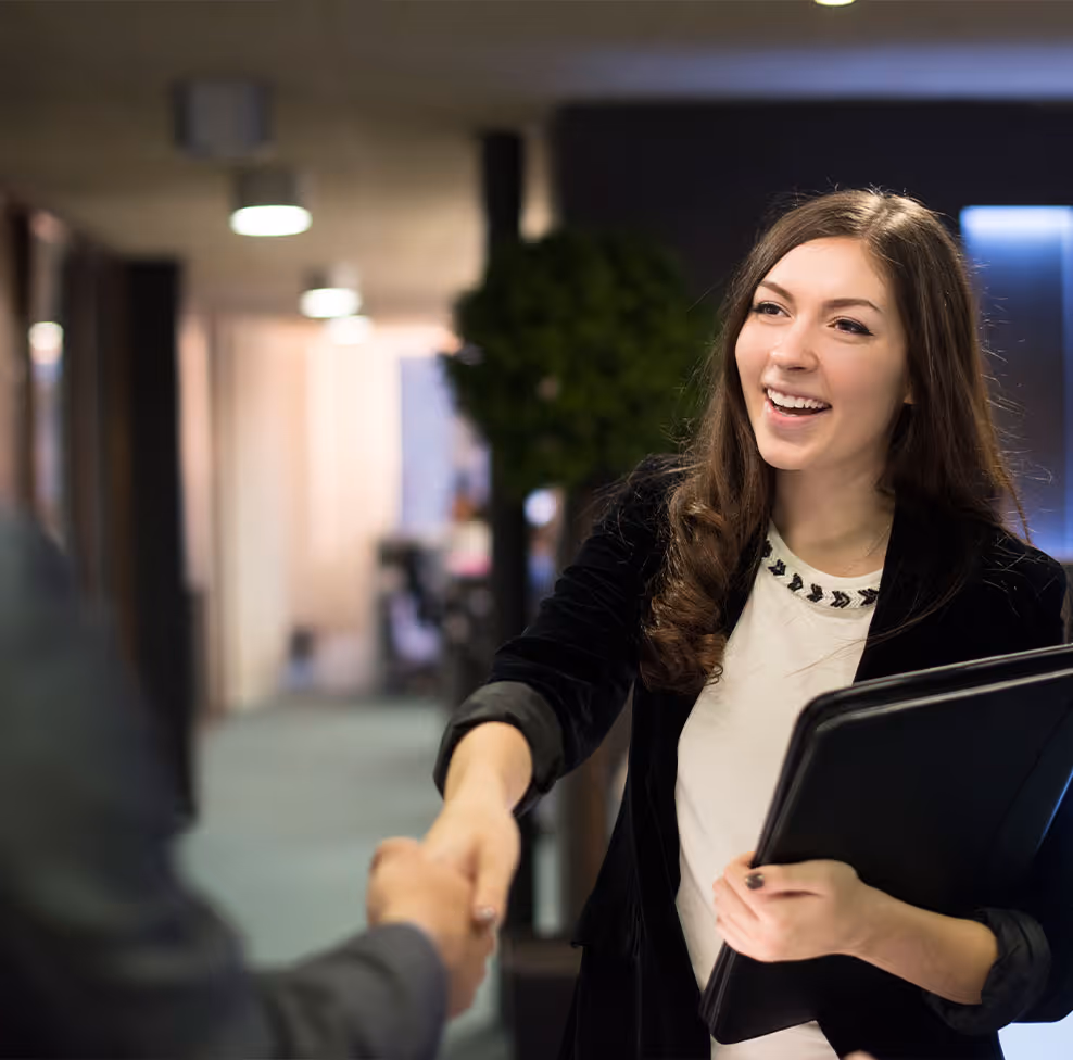 Sales rep shaking hands with potential customer