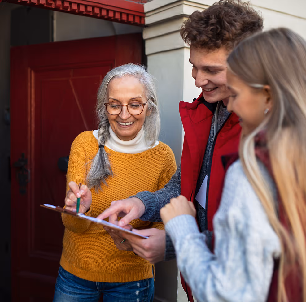 Sales rep talking to customers in residential neighborhood