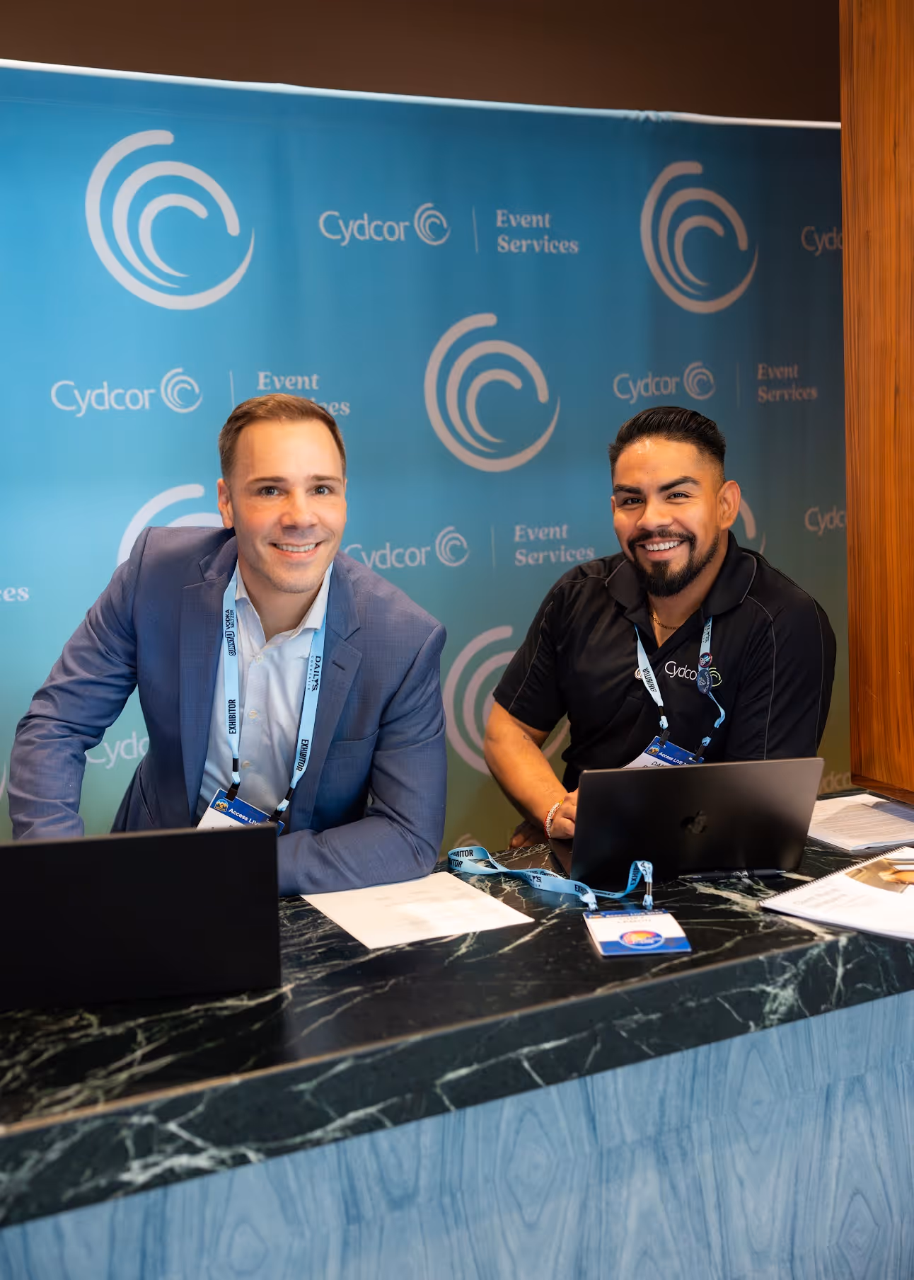 Cydcor event services booth meeting with prospective clients, symbolizing Cydcor reviews and relationships.