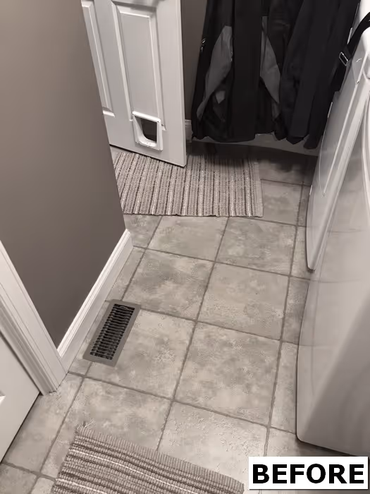 Unorganized laundry space with shelves and storage items