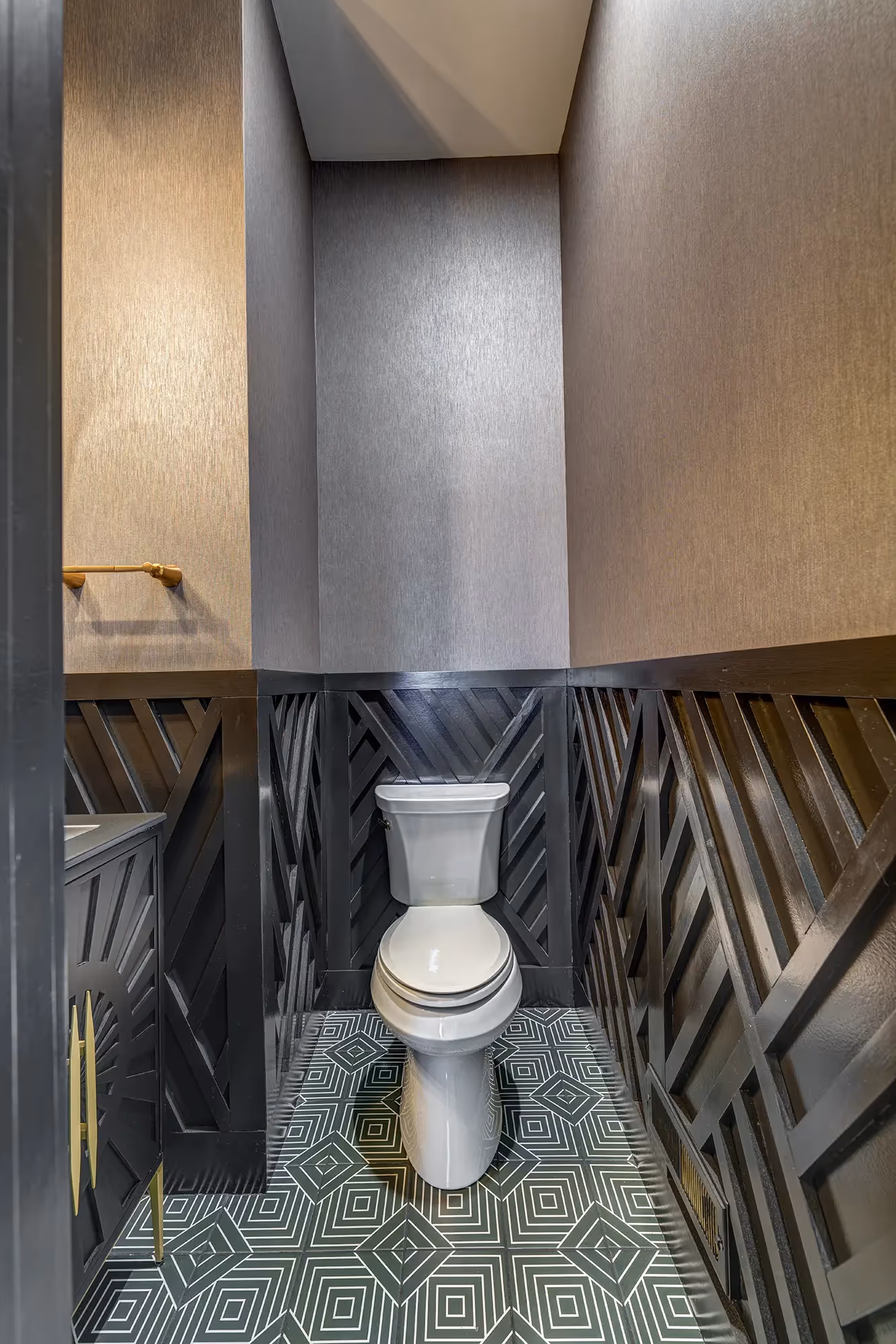 Stylish powder room featuring geometric tile flooring and textured wallpaper in mechanicsburg, pa.