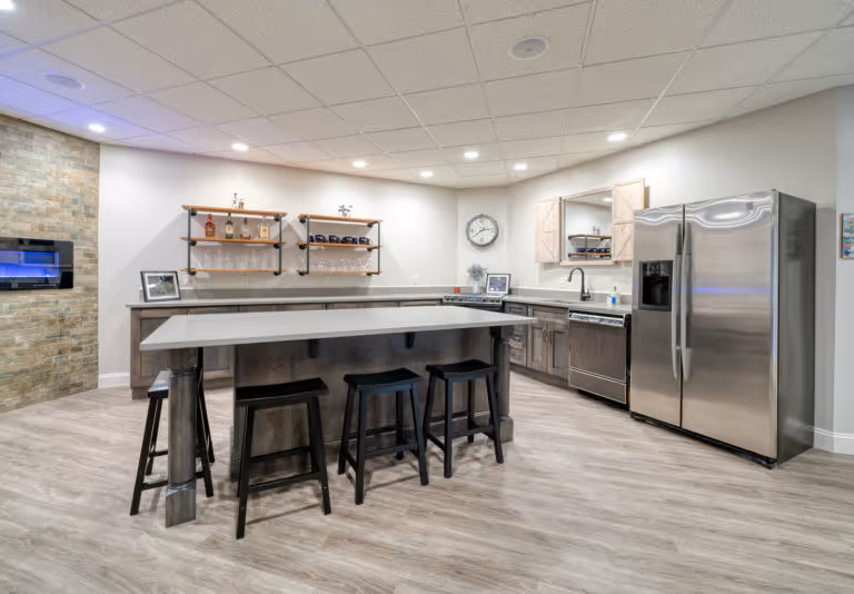 Modern kitchen design with gray wood cabinets and a stylish island in Mechanicsburg, PA