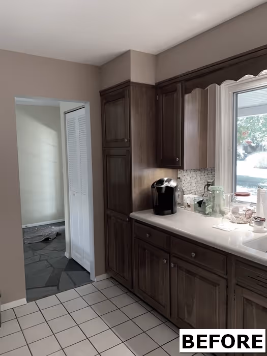 Kitchen area with dark cabinets