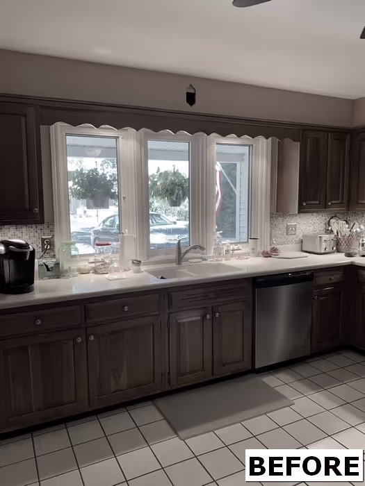Kitchen area with dark cabinets