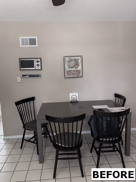 Kitchen area with dark cabinets