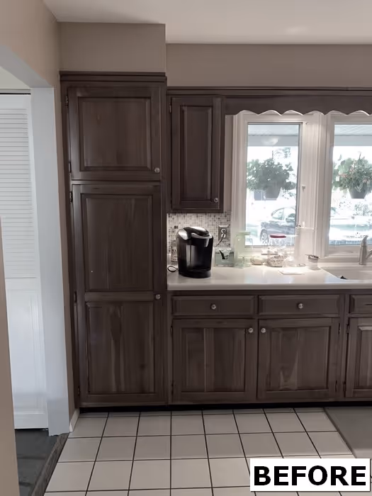 Kitchen area with dark cabinets