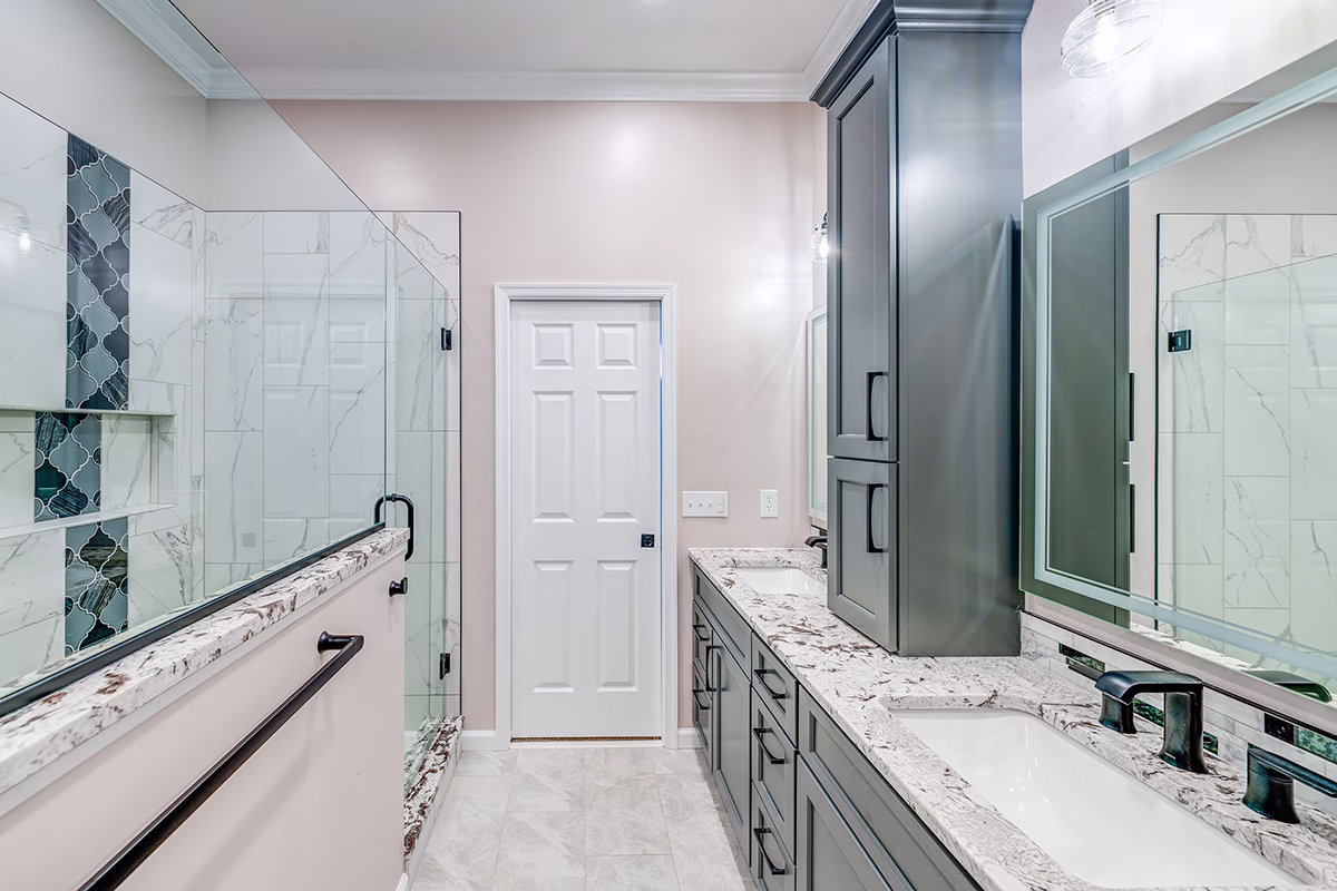 Stylish brown primary bathroom featuring modern fixtures, dual sinks, and elegant marble countertops in Harrisburg, PA.