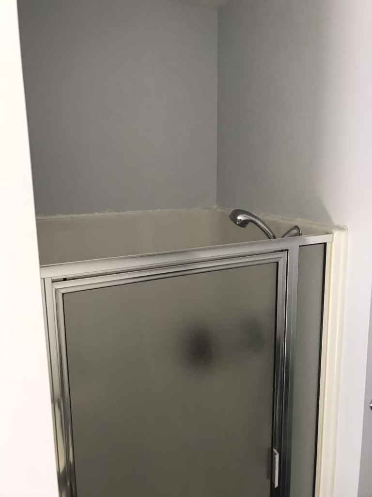 Compact bathroom shower with glass door and sleek design in Mechanicsburg, PA
