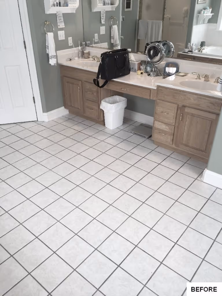 Modern bathroom with beige cabinetry, dual sinks, and light-colored tile flooring in Hummelstown, PA