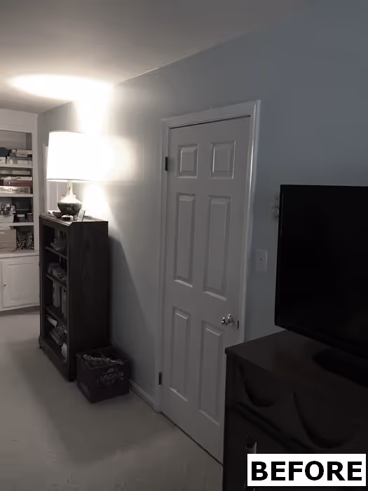 Cozy living room in mechanicsburg, pa featuring soft blue walls, wooden furniture, and warm lighting.