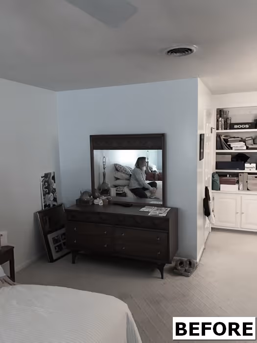Cozy bedroom featuring a wooden dresser, mirror, and organized storage in Mechanicsburg, PA.
