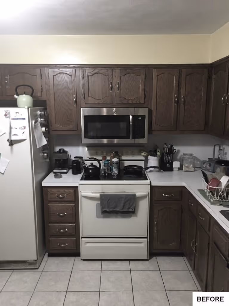 Cozy kitchen in Mechanicsburg, PA with wooden cabinets, stainless steel appliances, and tiled flooring.