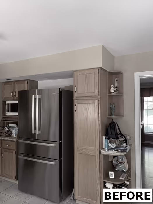 Modern kitchen with stainless steel appliances and wood cabinets in floribunda heights, camp hill, pa.