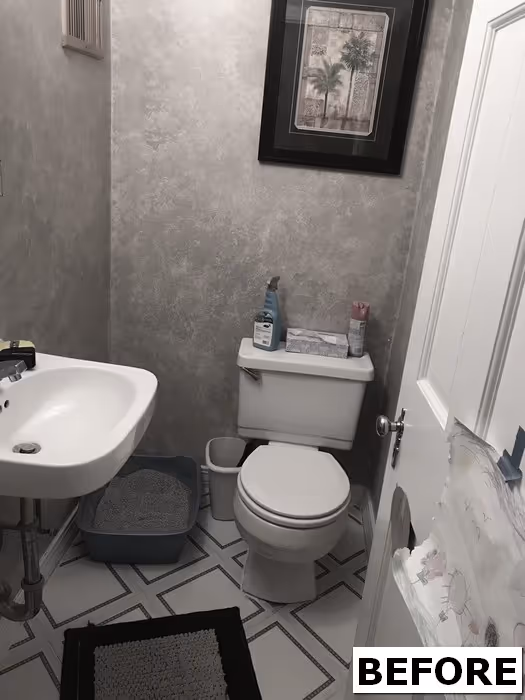 Before renovation of a small powder room with gray walls and basic fixtures in new cumberland, pa