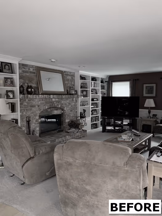 Cozy living room with beige recliners, brick fireplace, and display shelves in Mechanicsburg, PA.