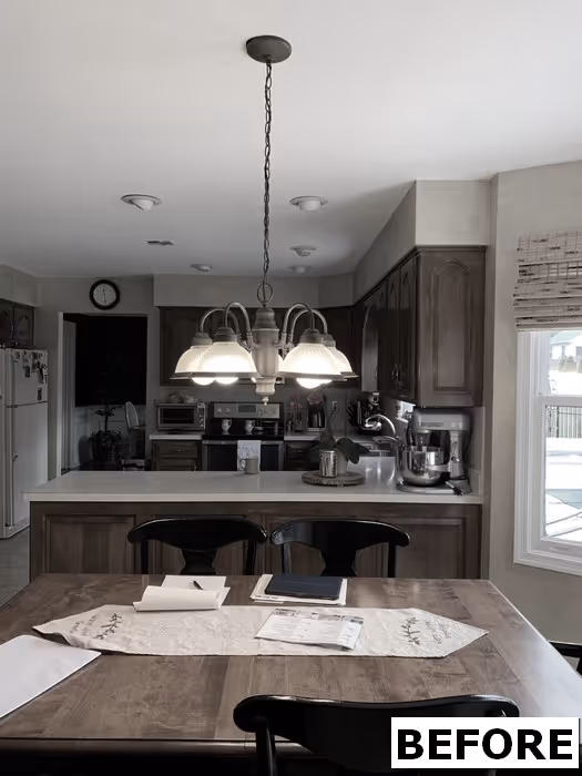 Modern kitchen in Mechanicsburg, PA featuring wooden cabinetry, a center island, and warm lighting.