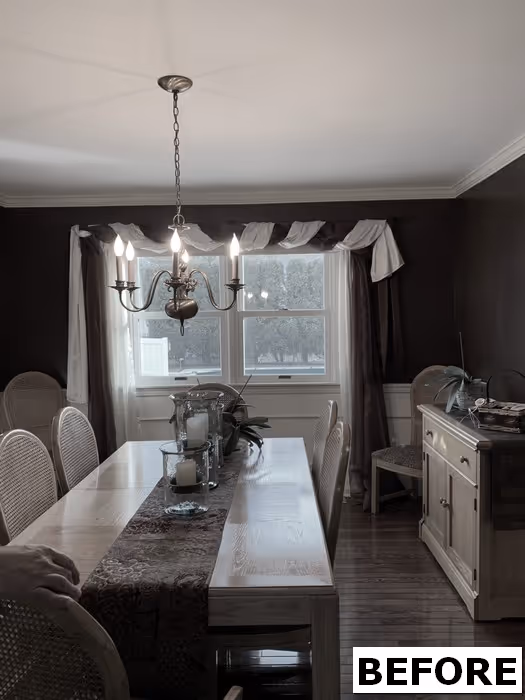 Traditional dining room in Mechanicsburg, PA featuring wooden table and chandelier with elegant curtains.