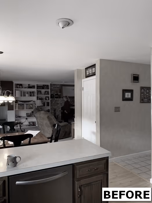 Before image of a kitchen and dining area featuring wooden cabinets, light countertops, and a cozy ambiance in Mechanicsburg, PA