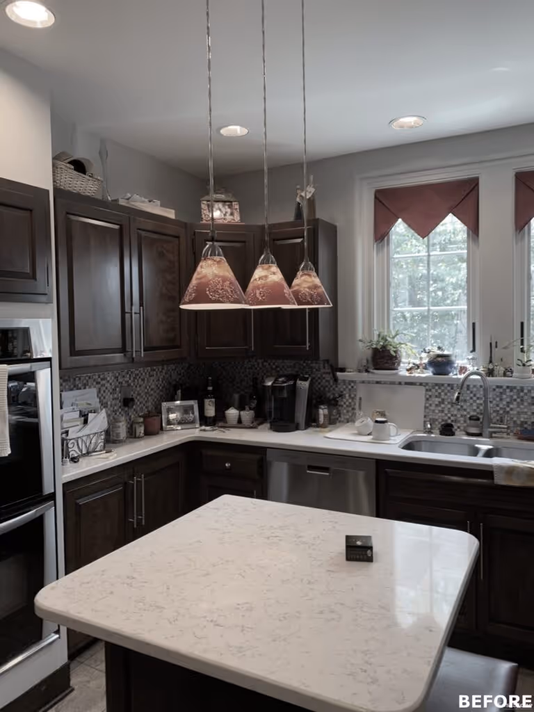 Cozy kitchen in Harrisburg, PA featuring dark wood cabinets, a marble countertop, and unique pendant lighting.